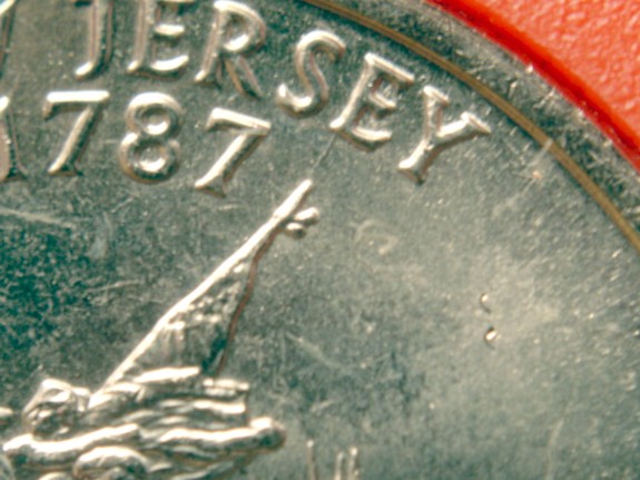1999-D-New-Jersey-St.-Quarter---Extended-Flag-Pole-Die-Gouge